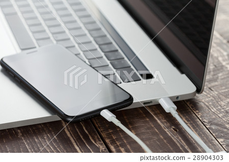 usb cable connect phone and laptop computer 28904303