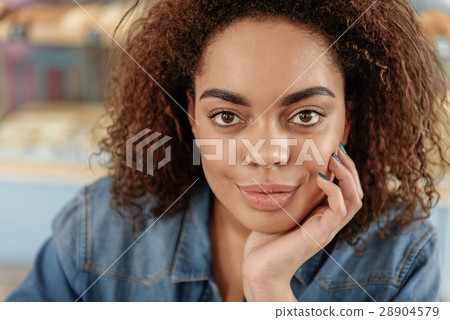 Happy smiling young mulatto woman 28904579