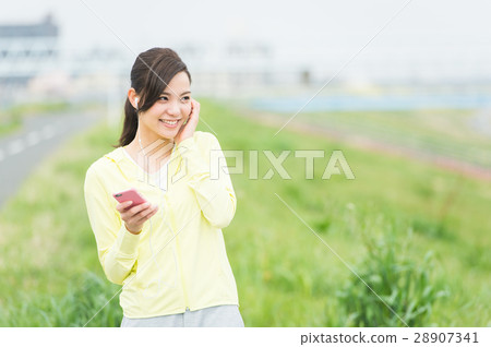 A woman listening to music 28907341
