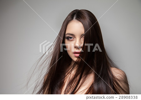 Pretty brunette looking at camera Pretty brunette looking at camera 28908338