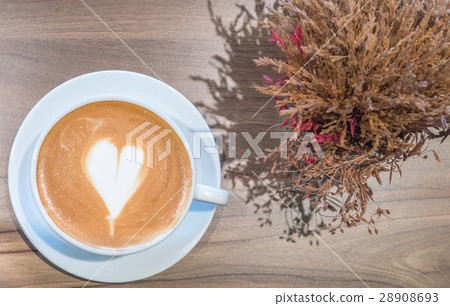 Hot coffee in white cup on wooden table Hot coffee in white cup on wooden table 28908693