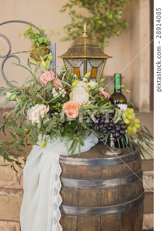 grapes on vase near flowers and bottle of vine grapes on vase near flowers and bottle of vine 28914085