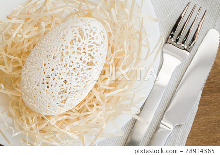 Table Setting for Easter Celebration. Carved Egg. 28914365