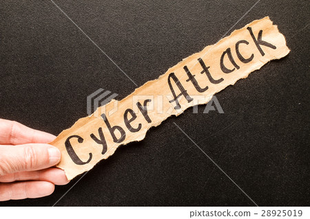 Torn paper with text CYBER ATTACK 28925019