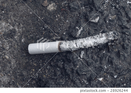 smoked cigarette drop on the ground smoked cigarette drop on the ground 28926244