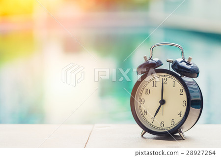 7 o'clock retro clock at the swimming pool. 7 o'clock retro clock at the swimming pool. 28927264