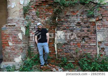 old brick wall man stand 28929591