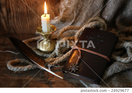retro book candle and feather retro book candle and feather 28929677