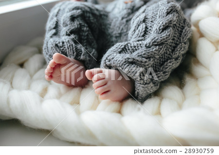 Small baby in knitted clothes Small baby in knitted clothes 28930759