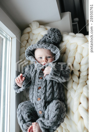 Small baby in knitted clothes Small baby in knitted clothes 28930761