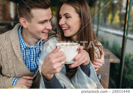 Couple sitting at sidewalk cafe 28931449