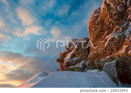 rock covered with snow and fog 28933943