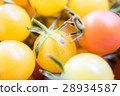 Little tomatoes  yellow and red color close up and 28934587