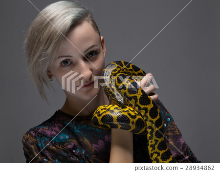 Blond smiling woman holding anaconda 28934862
