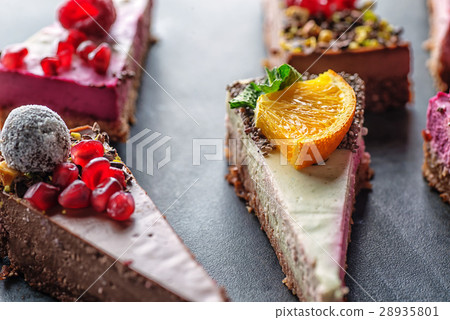 raw vegan cakes with fruit and seeds, decorated 28935801