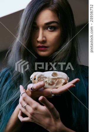 Portrait of a young girl holding a mysterious 28936752