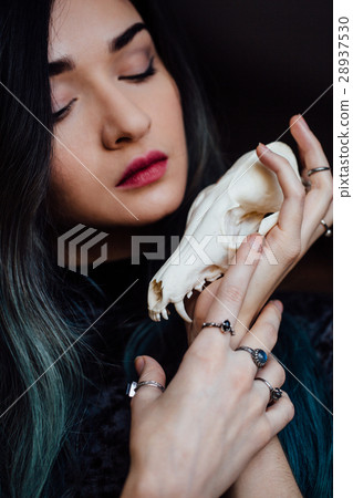 Portrait of a young girl holding a mysterious 28937530