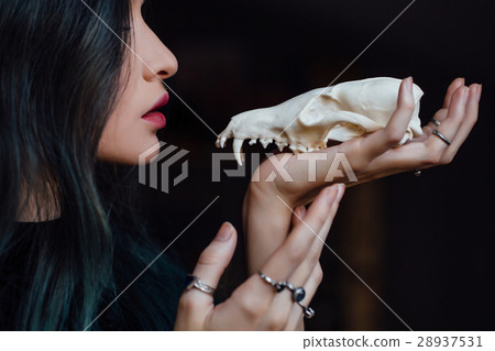 Portrait of a young girl holding a mysterious 28937531