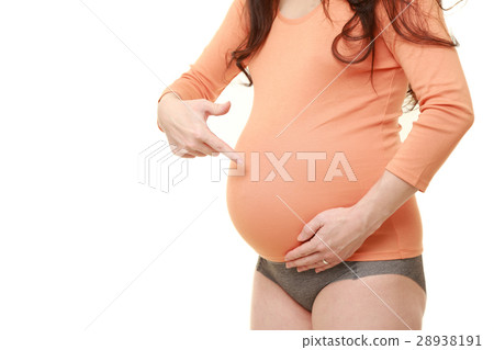 A pregnant woman of a pregnant wife who points to her stomach 28938191