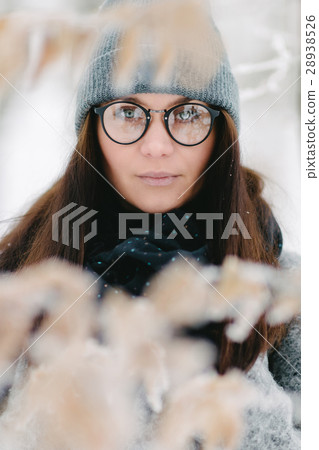 Portrait of a brunette wearing glasses and a gray 28938526
