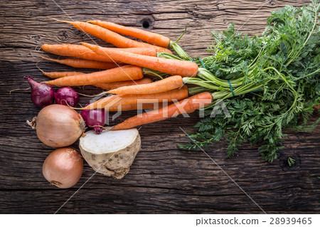 Carrot celery onion. Fresh vegetable on old table. Carrot celery onion. Fresh vegetable on old table. 28939465
