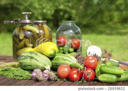 Pickled cucumbers in a glass jars 28939652