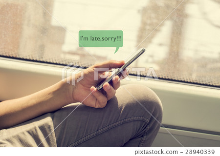 young man writing a message to apologize 28940339