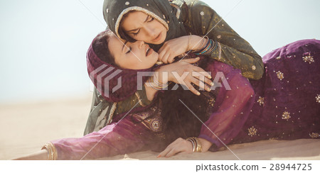 Women thirsty in a desert. Unforeseen Women thirsty in a desert. Unforeseen 28944725