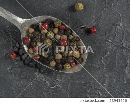 Colorful peppercorn in spoon on gray background 28945336