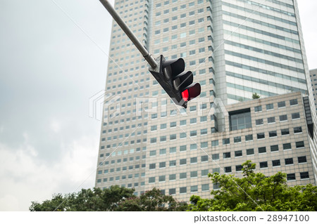 Traffic light on skyscraper background Traffic light on skyscraper background 28947100