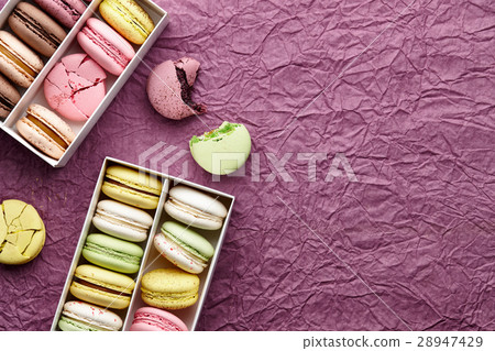 Colorful macarons on textured background 28947429