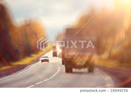 background blur road autumn sunbeams glare 28949256