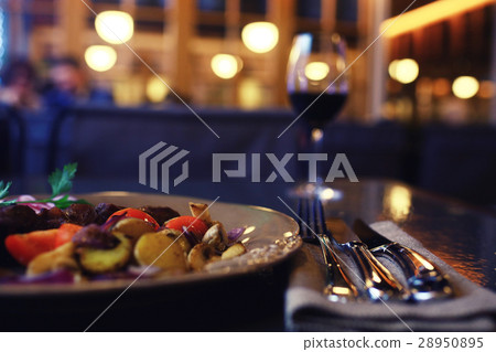 Serving a glass of red wine in a restaurant Serving a glass of red wine in a restaurant 28950895