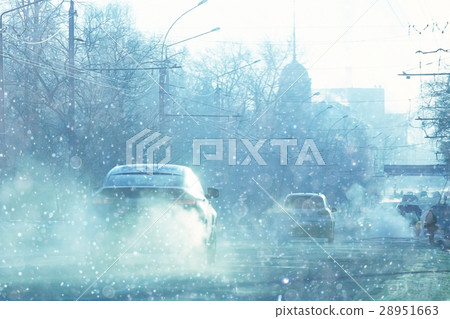 Snow in the city on the road view from the car Snow in the city on the road view from the car 28951663