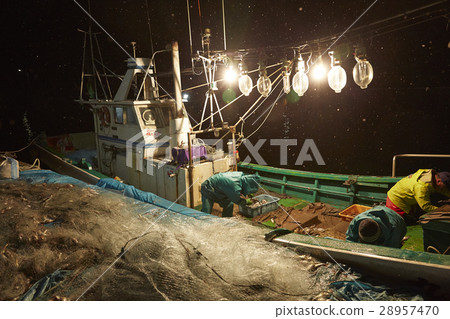 Fishermen working at midnight 28957470