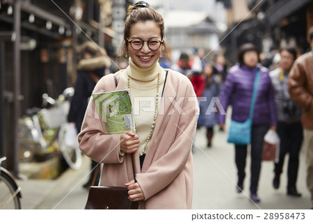 A woman sightseeing old streets A woman sightseeing old streets 28958473