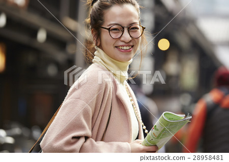 A woman sightseeing old streets 28958481