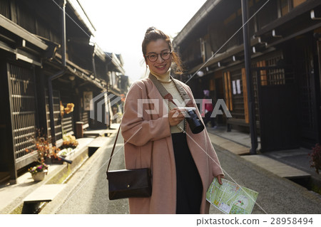 A woman sightseeing old streets 28958494