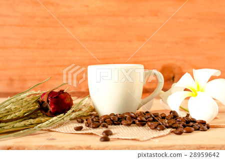 hot coffee in the white cup on wooden table hot coffee in the white cup on wooden table 28959642