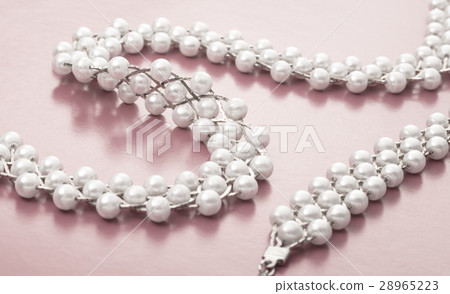 Necklace and wristband with white beads Necklace and wristband with white beads 28965223