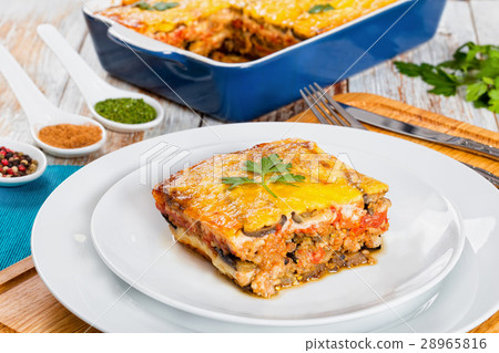 portion of delicious moussaka on plate, close-up portion of delicious moussaka on plate, close-up 28965816
