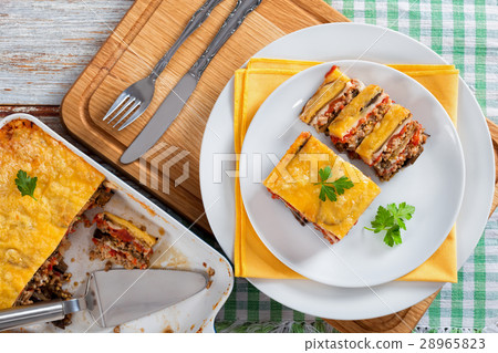 portion of layered moussaka cut into slices 28965823