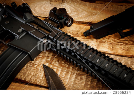assault rifle on a wooden table assault rifle on a wooden table 28966224