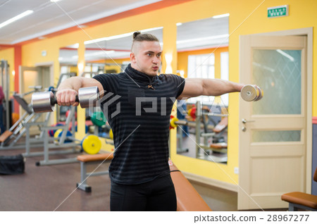 Young handsome athlete in old rusty gym Young handsome athlete in old rusty gym 28967277