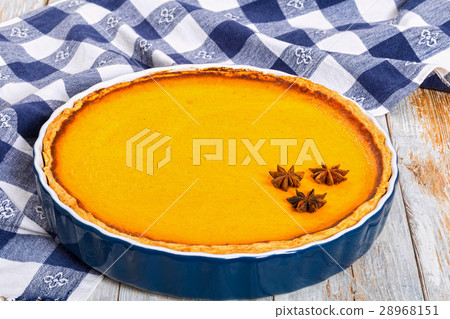 Fresh round bright orange pumpkin pie 28968151