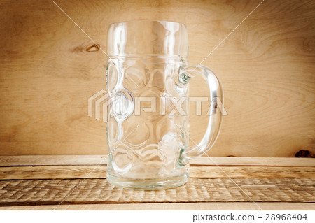 Empty beer mug on the table 28968404