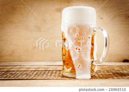 delicious beer on a wooden table 28968510