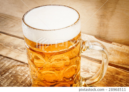 delicious beer on a wooden table 28968511