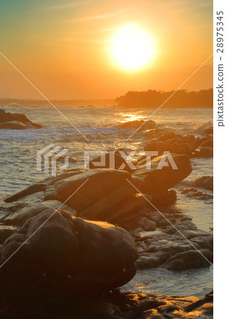 tropical sea sunset on stone beach tropical sea sunset on stone beach 28975345