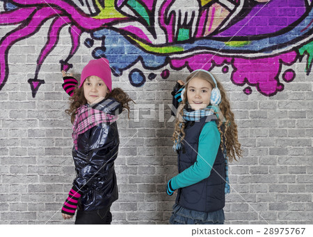 Girls with spray can and wall 28975767